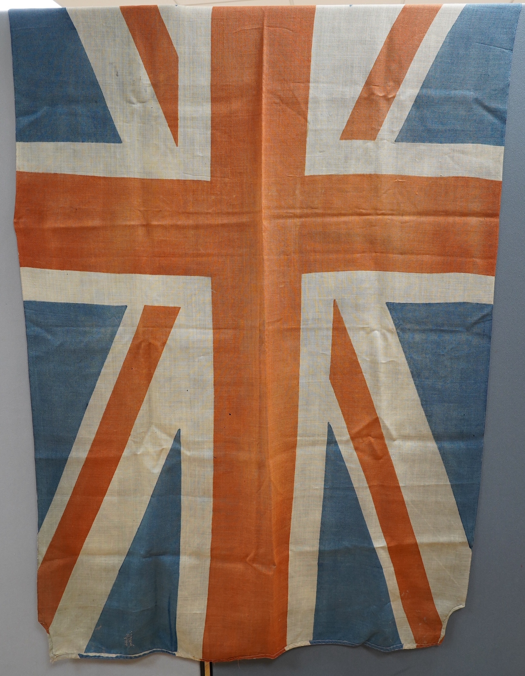 Eight mostly mid 20th century Union Jack flags, one celebrating Queen Victoria’s Diamond Jubilee, together with a Saint George’s cross and a string of Union flag bunting. Condition - poor to good